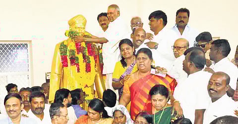 Assembly Speaker M Appavu garlanding the statue of freedom fighter VO Chidambaram on his 153rd birth anniversary in Tirunelveli 