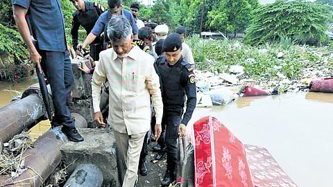 CM Nara Chandrababu Naidu inspecting the flood situation at Madhura Nagar, 
Devinagar and Pasuputota areas in Vijayawada on Thursday