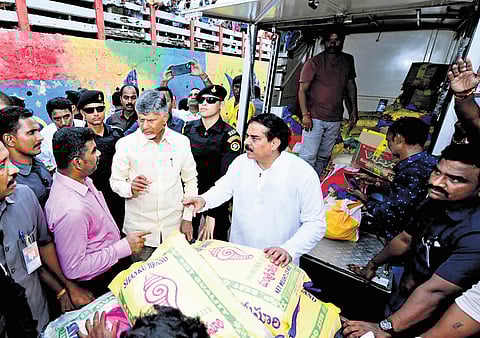 Chief Minister Nara Chandrababu Naidu oversees the distribution of essentials’ kits to the flood affected people in Vijayawada on Friday 