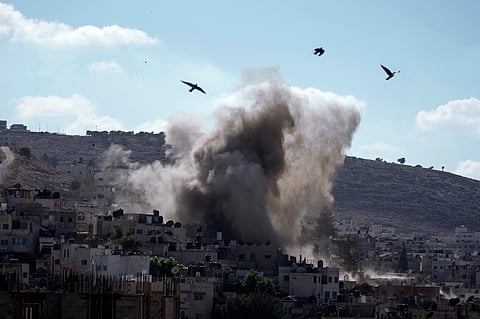An explosion is seen during an Israeli military operation in the West Bank city of Jenin