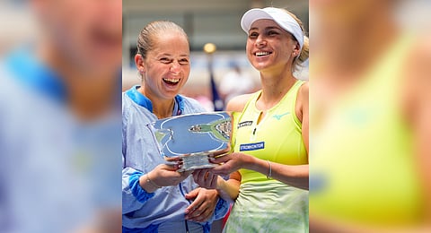 Jelena Ostapenko (L) and Lyudmyla Kichenok after winning the women's doubles final at the US Open on Friday 