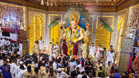Devotees offer prayers to Lord Ganesh at the Lalbaugcha Raja on Ganesh Chaturthi festival, in Mumbai.