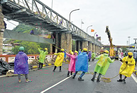 Repair works for the counterweight of gate 69 at Prakasam Barrage were underway in Vijayawada on Sunday.