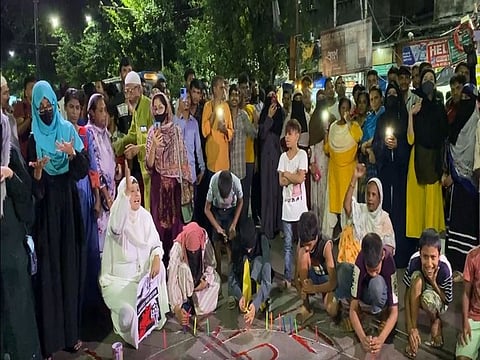 Women protest in Kolkata's Raja Bazar demanding justice for RG Kar rape-murder victim. 