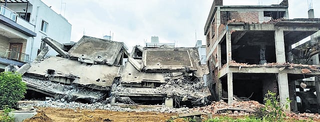 A structure demolished by the HYDRAA in full tank level and buffer zones in Katwa Cheruvu in Hyderabad on Sunday