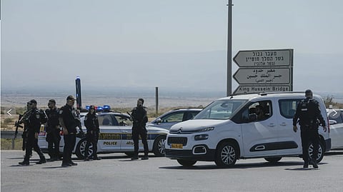Israeli police stand guard near the site of the deadly shooting attack.