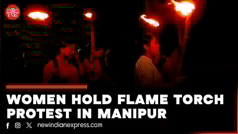 Members of All Manipur Students' Union (AMSU) charge towards a CRPF convoy during a protest march against the recent violence in the state, in Imphal.