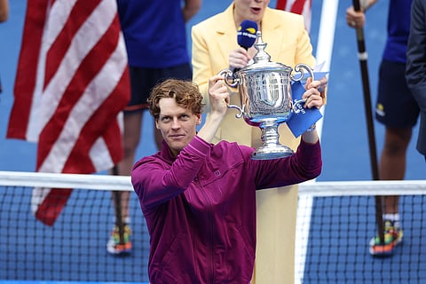 Italy's Jannik Sinner holds the trophy after winning his men's final match against USA's Taylor Fritz at the USTA Billie Jean King National Tennis Center in New York City, on September 8, 2024.