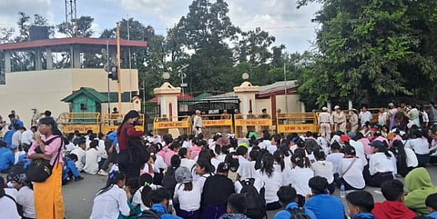 Members of All Manipur Students' Union (AMSU) charge towards a CRPF convoy during a protest march against the recent violence in the state, in Imphal.
