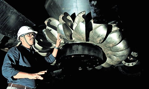 Assistant engineer Haridas Vijayan explaining the functioning of turbine at Pallivasal project 