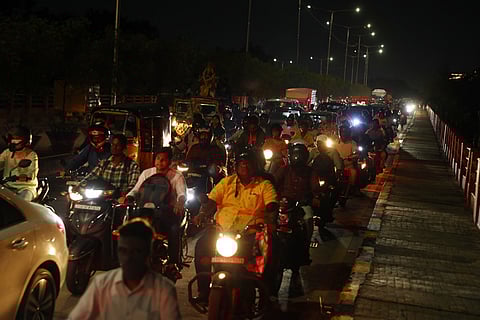 Slow vehicle movement at the Khairatabad flyover due to the traffic jam in Hyderabad.