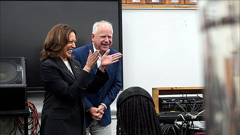 Democratic presidential nominee Vice President Kamala Harris and Democratic vice presidential candidate Minnesota Gov. Tim Walz speak to marching band members at Liberty County High School in Hinesville, Ga., Wednesday, Aug. 28, 2024.