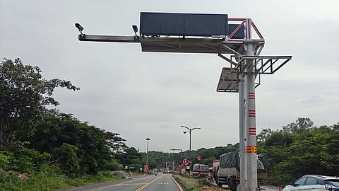 Tollgate staff in the process of setting up Automatic Number Player Recognition cameras in the ghat road at Thoppur in Dharmapuri district.