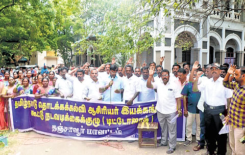 School teachers protesting under the banner of Tamil Nadu Elementary Teachers Organisations-Joint Action Committee, in Thanjavur on Tuesday