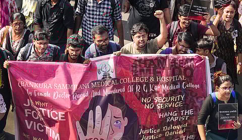 Doctors stage a protest march outside the Health Ministry against the brutal rape and murder of a postgraduate trainee doctor at Kolkata's RG Kar Hospital in New Delhi.