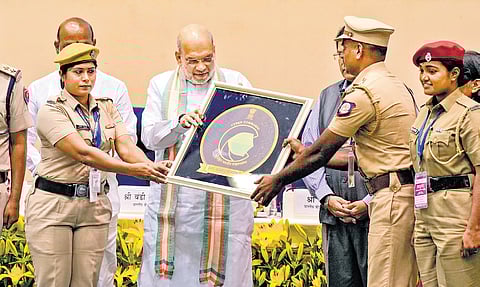 Home Minister Amit Shah presents certificate of recognition to cyber commandos during the 1st foundation day celebration of I4C, in New Delhi on Tuesday.