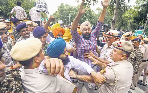 Members of BJP’s Sikh cell during their protest in Delhi on Wednesday.