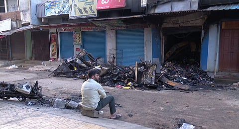 Charred remains of goods at a shop following clashes between two groups during a Ganesh Chaturthi procession, at Nagamangala in Mandya district, Thursday, Sept. 12, 2024.
