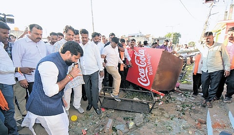 BJP leaders R Ashoka, CT Ravi and Sunil Kumar inspect the damage caused by miscreants in Nagamangala town on Thursday.