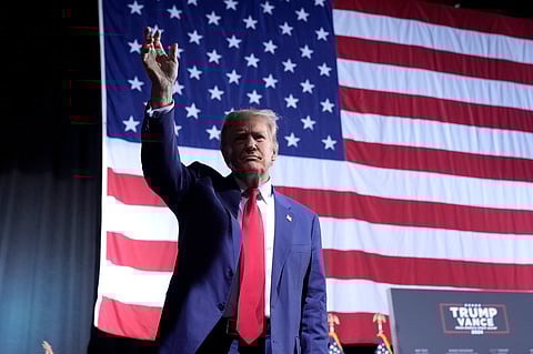Republican presidential nominee former President Donald Trump speaks to reporters in the spin room after a presidential debate with Democratic presidential nominee Vice President Kamala Harris.
