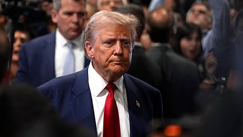 Republican presidential nominee former President Donald Trump speaks to reporters in the spin room after a presidential debate with Democratic presidential nominee Vice President Kamala Harris.