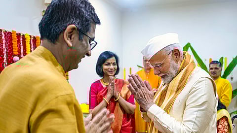 Prime Minister Narendra Modi exchanges greetings with CJI DY Chandrachud while attending 'Ganpati Poojan' at the latter's residence.
