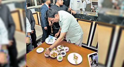 Chef Sanjeev Kapoor prepares a special fusion dish.