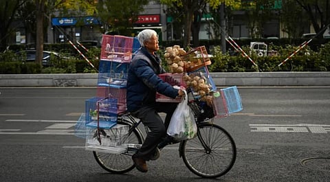 An old man in China cycles his way home. Newer retirees will have to wait three more years to led such a life. "I don't know how they thought up this policy, young people are already so anxious, now the retirement age is being extended," one comment on the new policy read.
