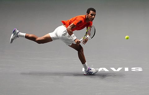 Canada's Felix Auger Aliassime makes a return against Finland's Otto Virtanen during a Davis Cup tennis match in Manchester.