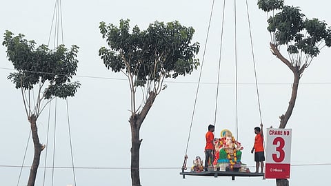 A Ganesh idol being immersed at People’s Plaza in Hyderabad 
on Wednesday 