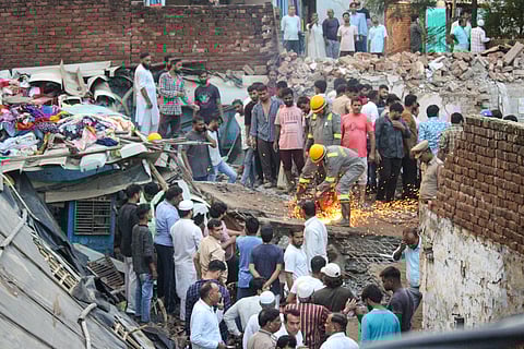 Rescue operation underway after a house collapsed, in Meerut, Saturday, Sept. 14, 2024. 