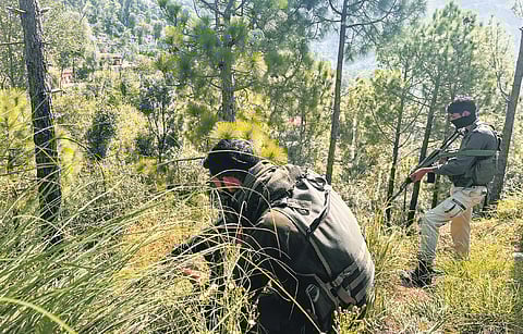 Security personnel during an encounter at Pathanateer of Poonch on Sunday.