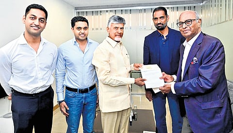 GVK Foundation Chairman GVK Reddy handed over a cheque for `5 crore to Chief Minister Nara Chandrababu Naidu towards flood relief on Sunday
