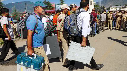 Polling officials leave for their respective polling stations on the eve of first phase of the Jammu and Kashmir Assembly election, in Kishtwar district.