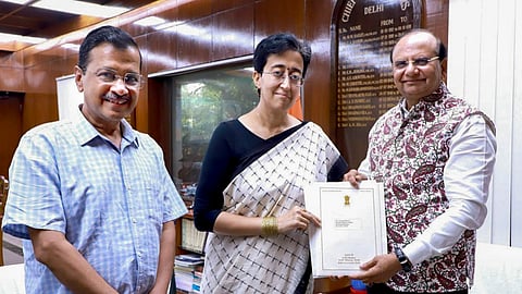 AAP legislative party leader Atishi with party chief Arvind Kejriwal meets Lt Governor V K Saxena to stake claim for forming a new government, in New Delhi.