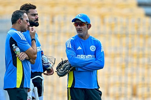 Virat Kohli (C), head coach Gautam Gambhir (R) and chief selector Ajit Agarkar speak during a practice session at the M.A. Chidambaram Stadium in Chennai ahead of their first cricket Test match against Bangladesh. 