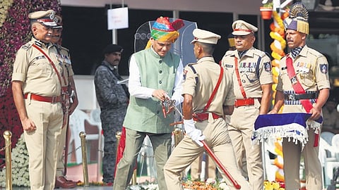 An IPS probationer receives the IPS Association’s Sword of Honour for the best Outdoor Probationer during the passing out parade at SVPNPA