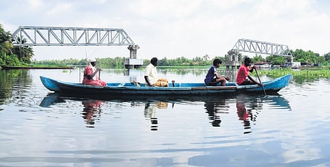 Valanthakkadu residents travelling on a boat