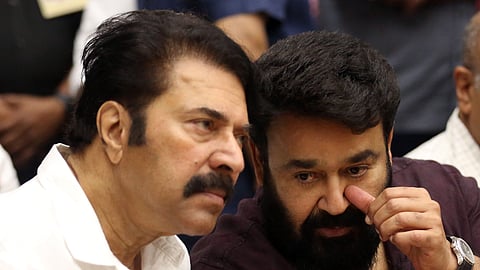 Actors Mammootty and Mohanlal share a moment after paying tributes to Kaviyoor Ponnamma.