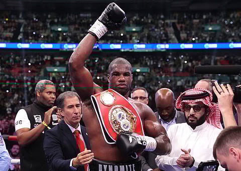 Daniel Dubois, center, celebrates victory against Anthony Joshua, not pictured, in the IBF World Heavyweight bout at Wembley Stadium, in London, Saturday, Sept. 21, 2024.