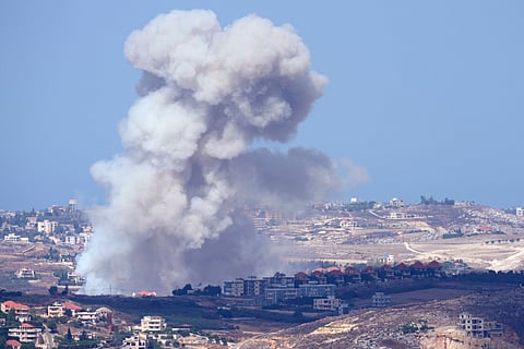 Smoke rises from Israeli airstrikes on villages in the Nabatiyeh district, seen from the southern town of Marjayoun, Lebanon, Monday, Sept. 23, 2024.