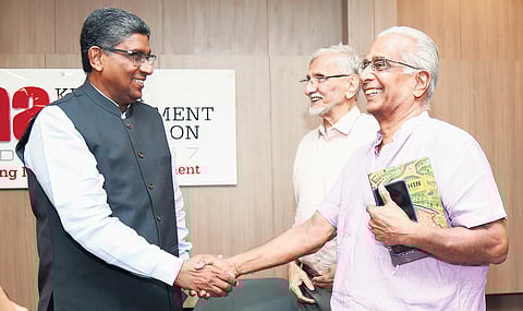 Veteran journalist and writer M K Das shares a light moment with Justice A K Jayasankaran Nambiar after the release of the book Cochin Fame and Fables authored by him in Kochi on Tuesday. Writer N S Madhavan is also seen