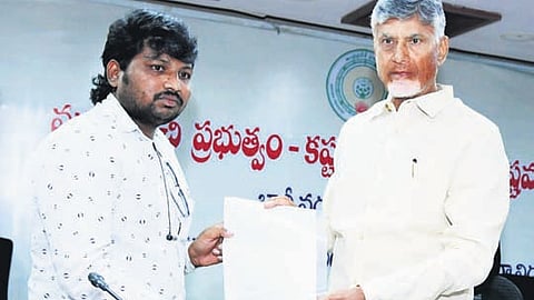Chief Minister Nara Chandrababu Naidu distributes compensation cheques to flood victims at the Collectorate in Vijayawada on Wednesday 