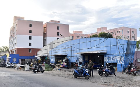 Picture of Ukkadam fish market along with newly constructed Housing unit on its back ground at Ukkadam in Coimbatore.