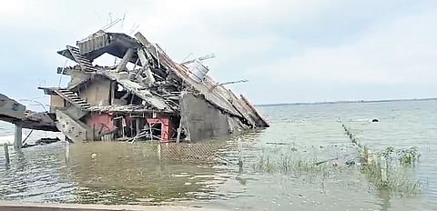 The demolished four-storey building in FTL of Pedda Cheruvu in Kondapur 