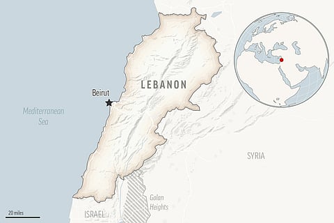 Destroyed buildings at a commercial street that was hit Saturday night by Israeli airstrikes, are seen in Nabatiyeh town, south Lebanon, Sunday, Oct. 13, 2024.