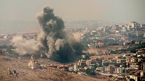 Smoke rises from Israeli airstrikes in the southern village of Kfar Rouman, seen from Marjayoun, south Lebanon, Wednesday, Sept. 25, 2024.