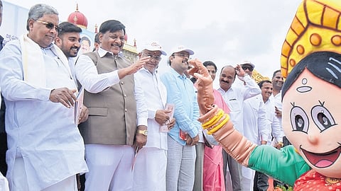 Chief Minister Siddaramaiah flags off a procession as part of World Tourism Day celebrations on the premises of Mysuru Palace