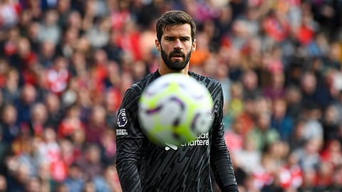 Liverpool's goalkeeper Alisson looks the ball during the English Premier League soccer match between Liverpool and Nottingham Forest at Anfield Stadium