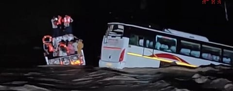 The bus got stuck on the raised path on a stream near Koliyak village.
